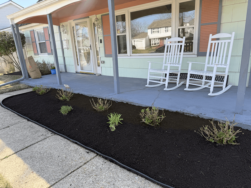 Front porch landscaping with fresh black mulch